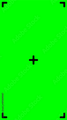 Vertical green screen background with black corner crop marks and a central plus crosshair tracking point for video post production, visual effects, and post production keying.