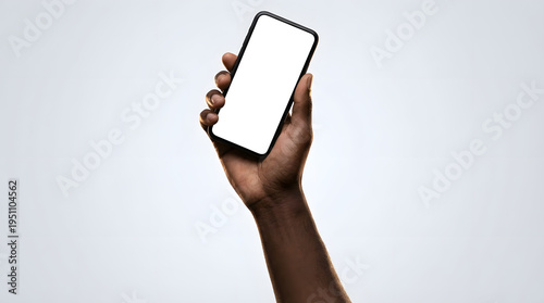 Dark-skinned Hand Hold Device with White Screen on Gray Background
