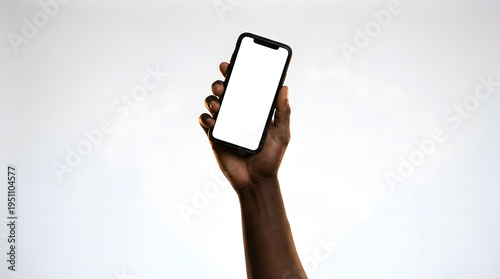 Dark-skinned hand hold modern smartphone blank screen against white background