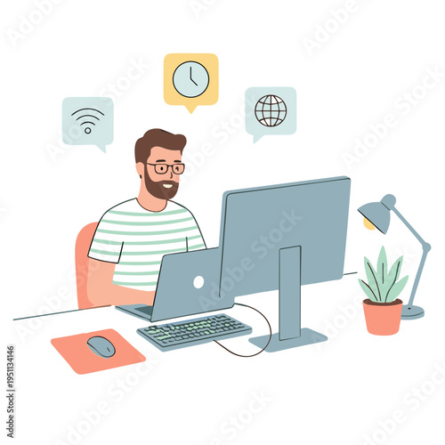 A man works on his computer and laptop at a desk indoors.