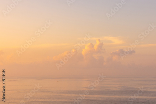 Fotografie Beautiful and Romantic Sunrise Morning Glow Over the Sea