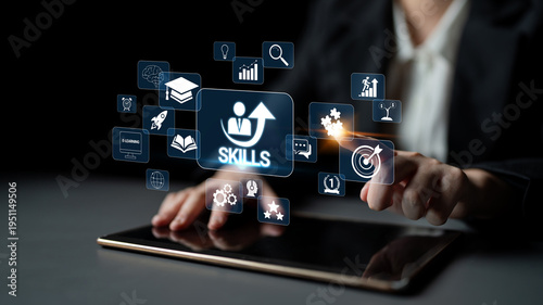 Canvas Print Business professional interacting with digital skill icons on tablet, showcasing personal development, learning, and career advancement strategies in a modern workspace Quark