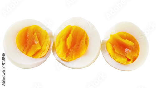 Konstfotografi Three perfectly cooked hard-boiled egg halves, showcasing vibrant yellow yolks a