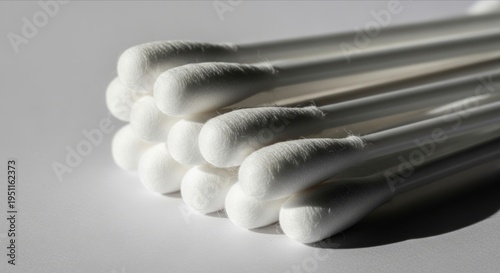 White Cotton Swabs Stacked on a Clean Surface with Soft Lighting