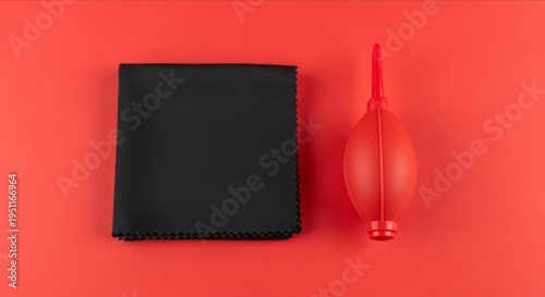 Cleaning Tools on Red Background with Air Blower and Cloth