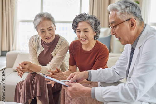 Seniors meeting with their doctor at the nursing home