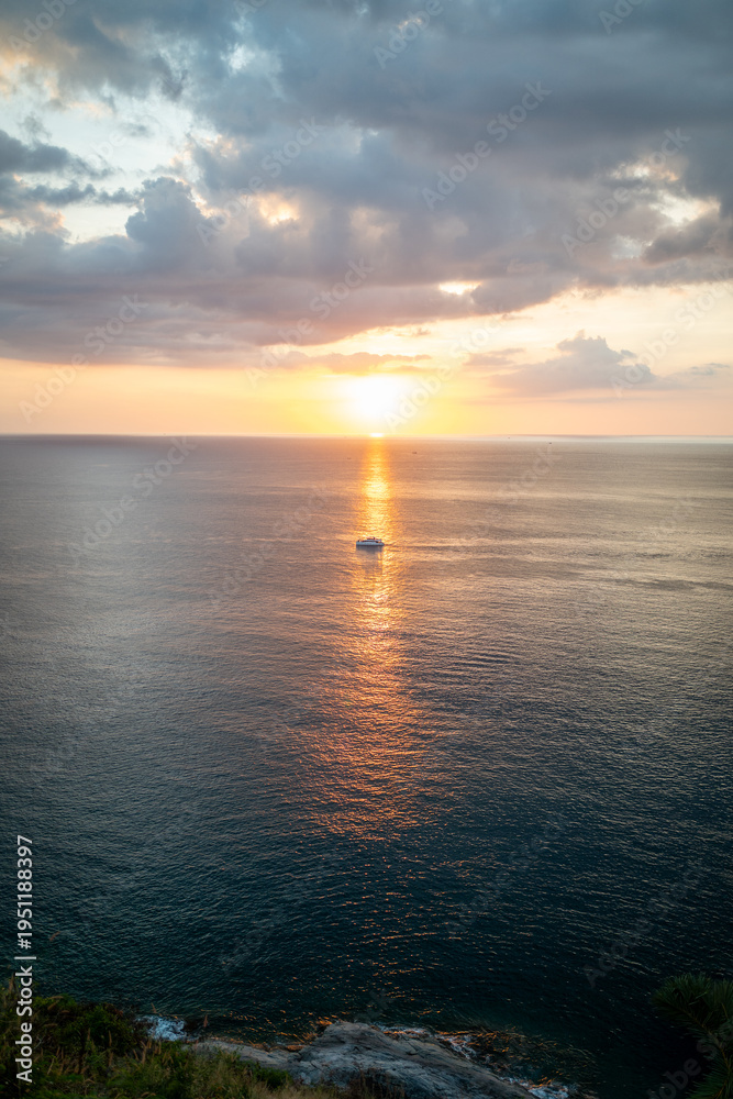 Fototapeta premium Minimal sunset with golden reflection at Promthep Cape Phuket Thailand