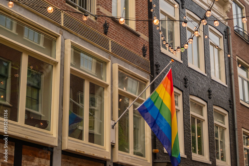 Photography Colorful flags and warm lights in the streets of Amsterdam during autumn