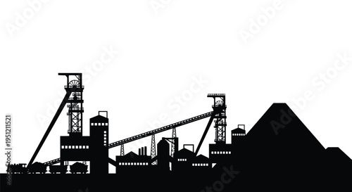 Silhouetted industrial complex with mining structures and a pyramid