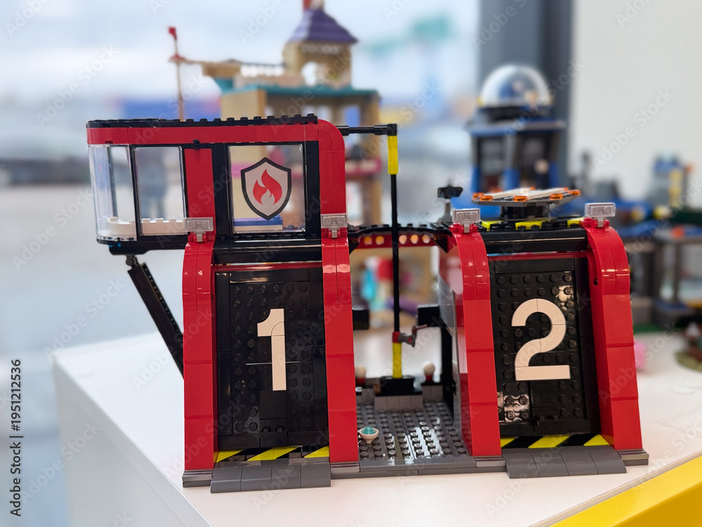 Fototapeta premium Red toy fire station with numbered doors