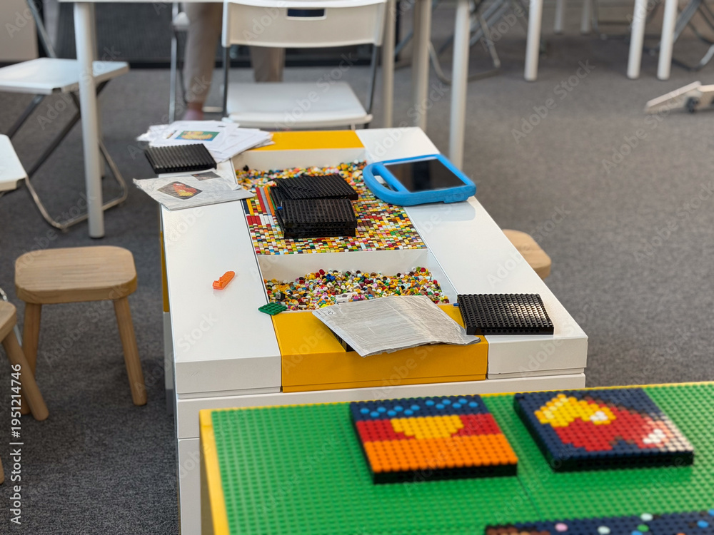 Fototapeta premium Children's mosaic play table with lego and craft supplies