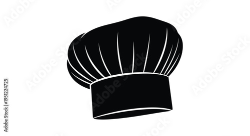 Black chef s toque rests against a white backdrop a striking silhouette