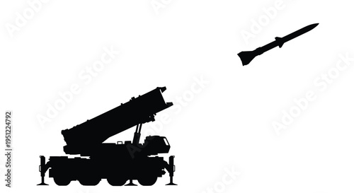 Military missile launcher firing a rocket into the sky silhouette