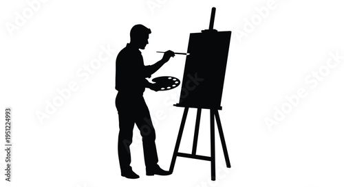 Artist painting at an easel a striking black silhouette