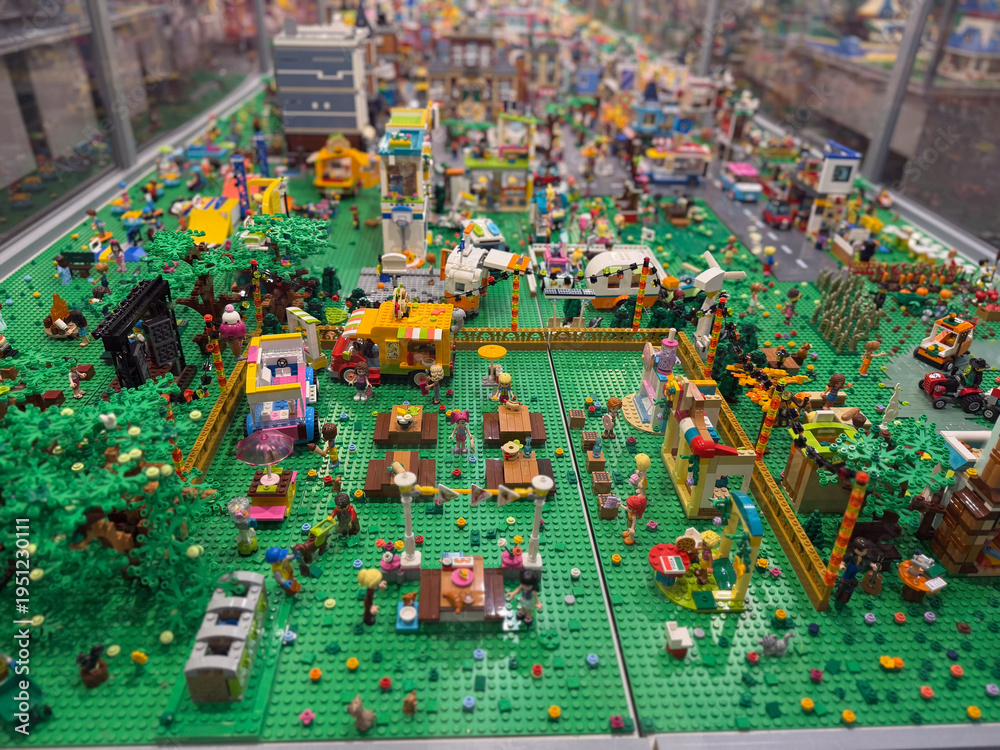 Naklejka premium Colorful lego park diorama in glass display case