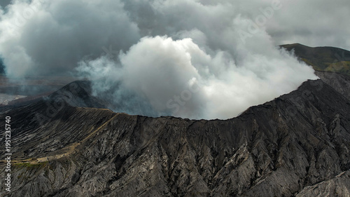 Foto Massive white plume rising from Mount Bromo crater, East Java, Indonesia