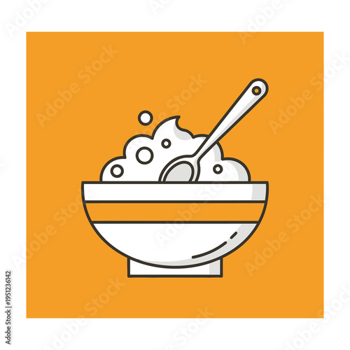 Bowl of bubbly soap suds with spoon on orange background