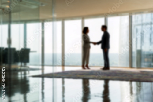 Blurred Business professionals shaking hands in modern office with city view