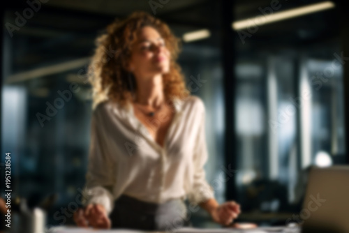Blurred Confident businesswoman relaxing in modern office space