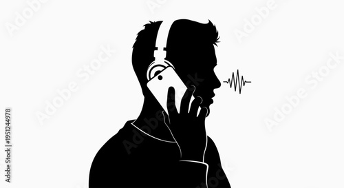 Man wearing headphones talking on phone.