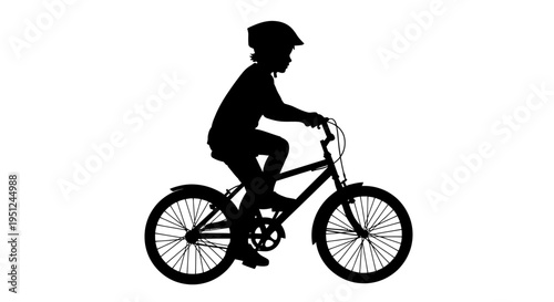 Boy Riding a Bicycle Silhouette Profile.