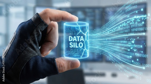Hand holding digital data silo breaking into network flow on futuristic screen