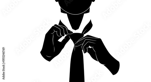 Man tying black necktie slowly.