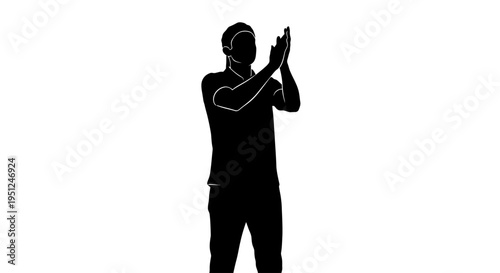 Man standing with hands up.