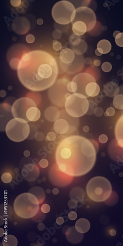 Soft golden bokeh lights on dark background with warm glowing blur circles