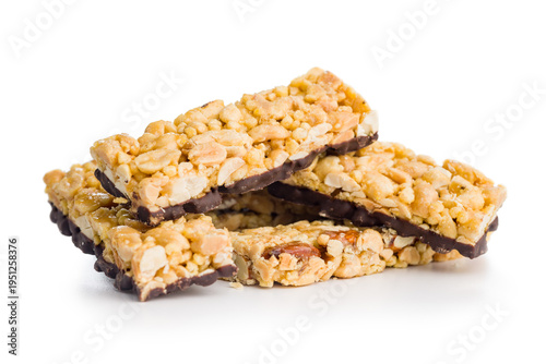 Canvas Print Stack of Chocolate-Coated Peanut Granola Bars With Nuts and Caramel on White Bac
