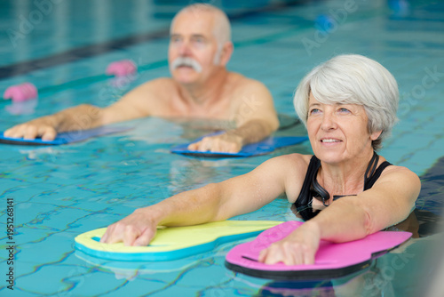 senior people in aquatic fitness class