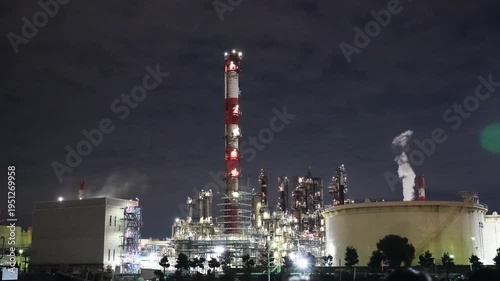 Night view of  industrial complex with glowing refineries