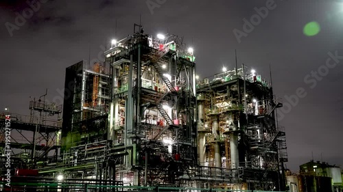 Night view of  industrial complex with glowing refineries