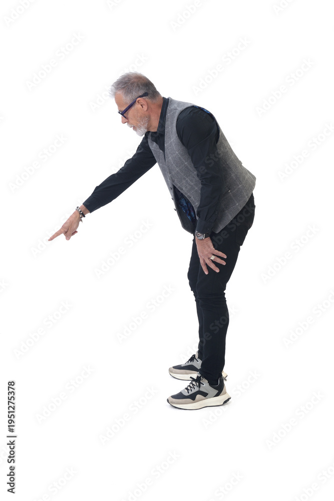 Fototapeta premium side side view of a modern retired man standing pointing down on white background