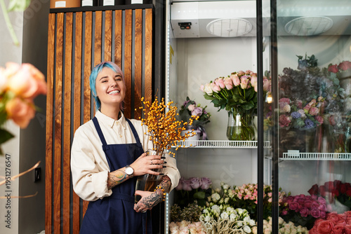 фотографія Young florist joyfully arranging vibrant blooms in her charming flower shop