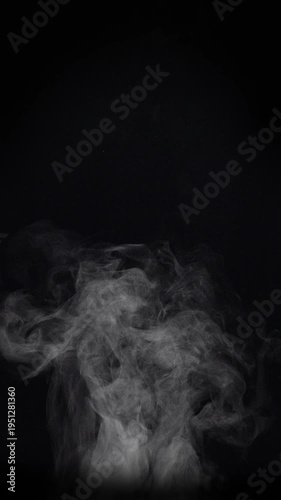 White natural rising steam from food or hot drink isolated on a black background. Сan be used in any projects with hot food.