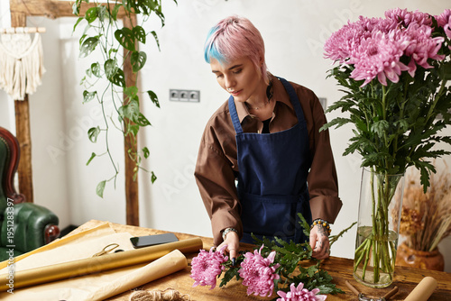 Quadro su tela Creative florist arranging vibrant flowers in a cozy flower shop