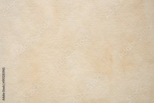 Old vintage paper texture background with aged stains and antique yellowed parchment effect