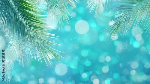 Green palm leaves frame a vibrant turquoise bokeh background, evoking summer.