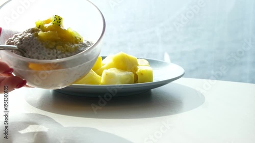 Chia seeds with cream yogurt stirring with spoon. Chia pudding healthy snack