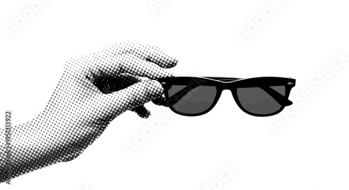 A hand holds sunglasses in a close-up view.