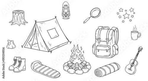 Camping gear and accessories arranged around a campfire outdoors at night