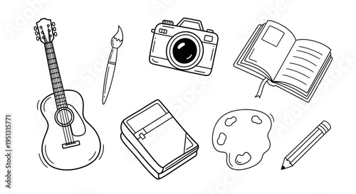 A collection of creative tools and instruments for art and music displayed on a table indoors.