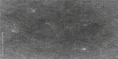 A detailed look at the dark surface, texture, and subtle nuances of a textured material, like a dark, slightly speckled paper.