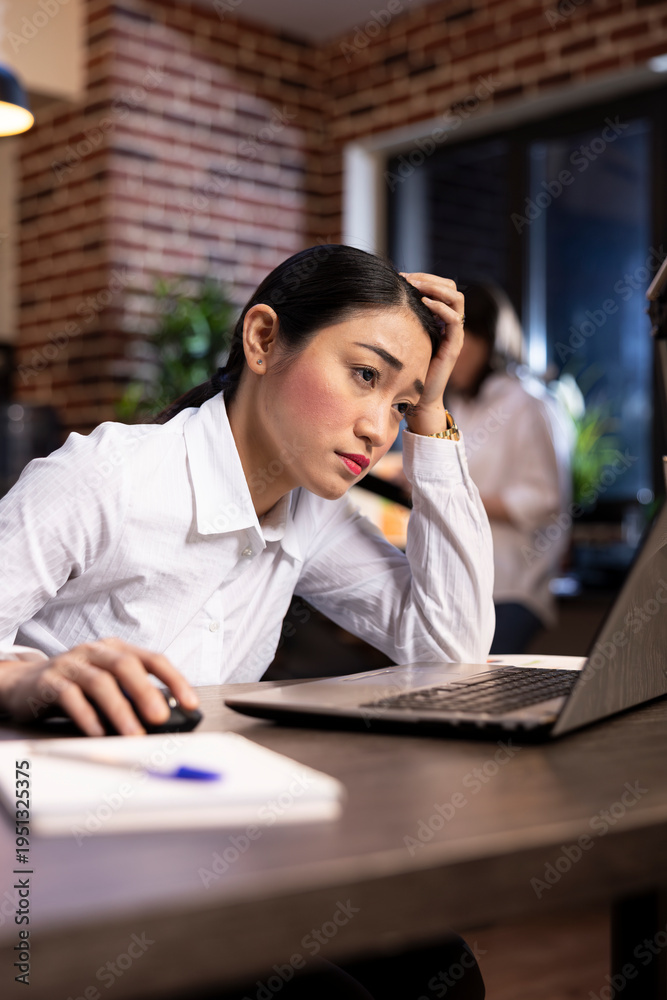 © DC Studio - Stress and fatigue are evident as a businesswoman works late into the night in a modern office, managing her workload and responsibilities under pressure. Career burnout and stress management. © DC Studio - Stress and fatigue are evident as a businesswoman works late into the night in a modern office, managing her workload and responsibilities under pressure. Career burnout and stress management.