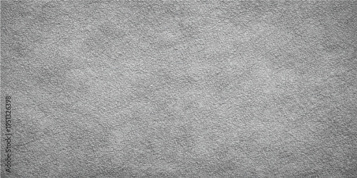 A textured gray surface, with its subtle variations and tactile feel, forms a versatile background, creating a visual canvas of depth and subtle interest.