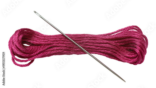 Photos Isolated vibrant magenta embroidery floss skein and shiny metal sewing needle fo