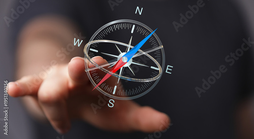 Hand pointing towards a com...