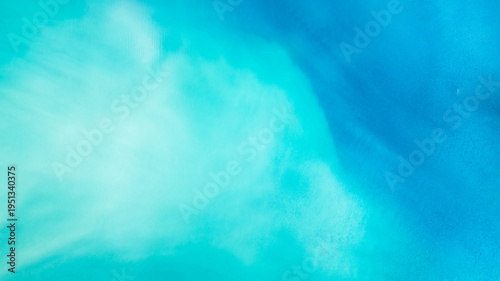 Aerial view of a serene expanse where turquoise and azure hues blend seamlessly, creating a tranquil vista of cool shades, Anterselva di Sopra, Trentino-Alto Adige, Italy.