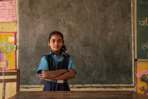 Obraz na płótnie Rural indian girl student standing in the classroom